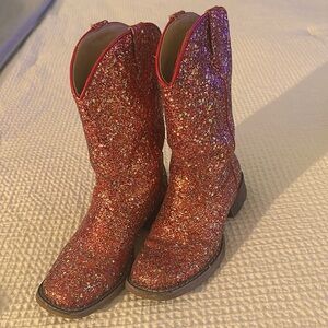 Roper cowgirl boots, red sequin with brown soles.